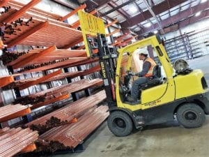 Forklift picks copper tube at United Pipe & Steel