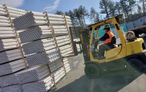 A United Pipe & Steel forklift picks PVC Pipe for loading